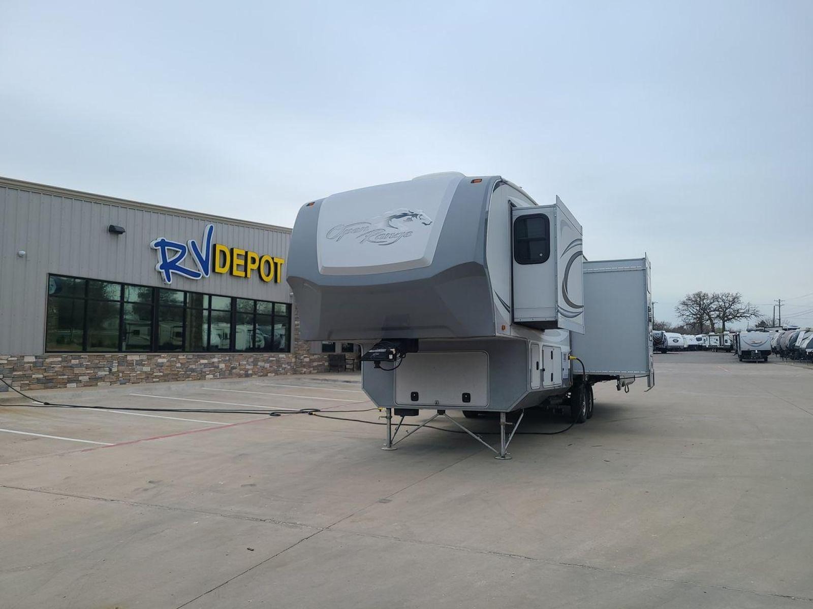 2013 GRAY OPEN RANGE 375BHS - (5XMFE382XD5) , Length: 37.83 ft. | Dry Weight: 10,320 lbs. | Gross Weight: 14,140 lbs. | Slides: 4 transmission, located at 4319 N Main St, Cleburne, TX, 76033, (817) 678-5133, 32.385960, -97.391212 - The 2013 Open Range 375BHS quadruple slide fifth wheel measures just under 38 feet long. It has a dry weight of 10,320 lbs. and a GVWR of 14,140 lbs. It also comes equipped with automatic heating and cooling for optimal temperature control. This fifth wheel has two bedrooms and can sleep up to 8 - Photo #0